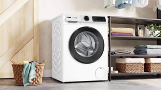 BOSCH WGJ24401BY SER6 перална машина, 9 кг, A, 1400 об/мин, 52/72dB(A), Iron Assist, waveDrum 65л, AntiStain 4 през приложението, черна-черносива врата, HC, наклонен директен сензорен дисплей